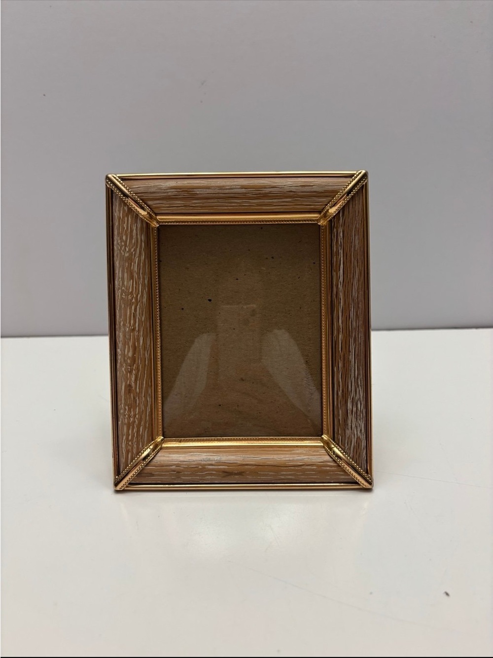 Small goldish /brownish color desk top / wall hanging picture frame